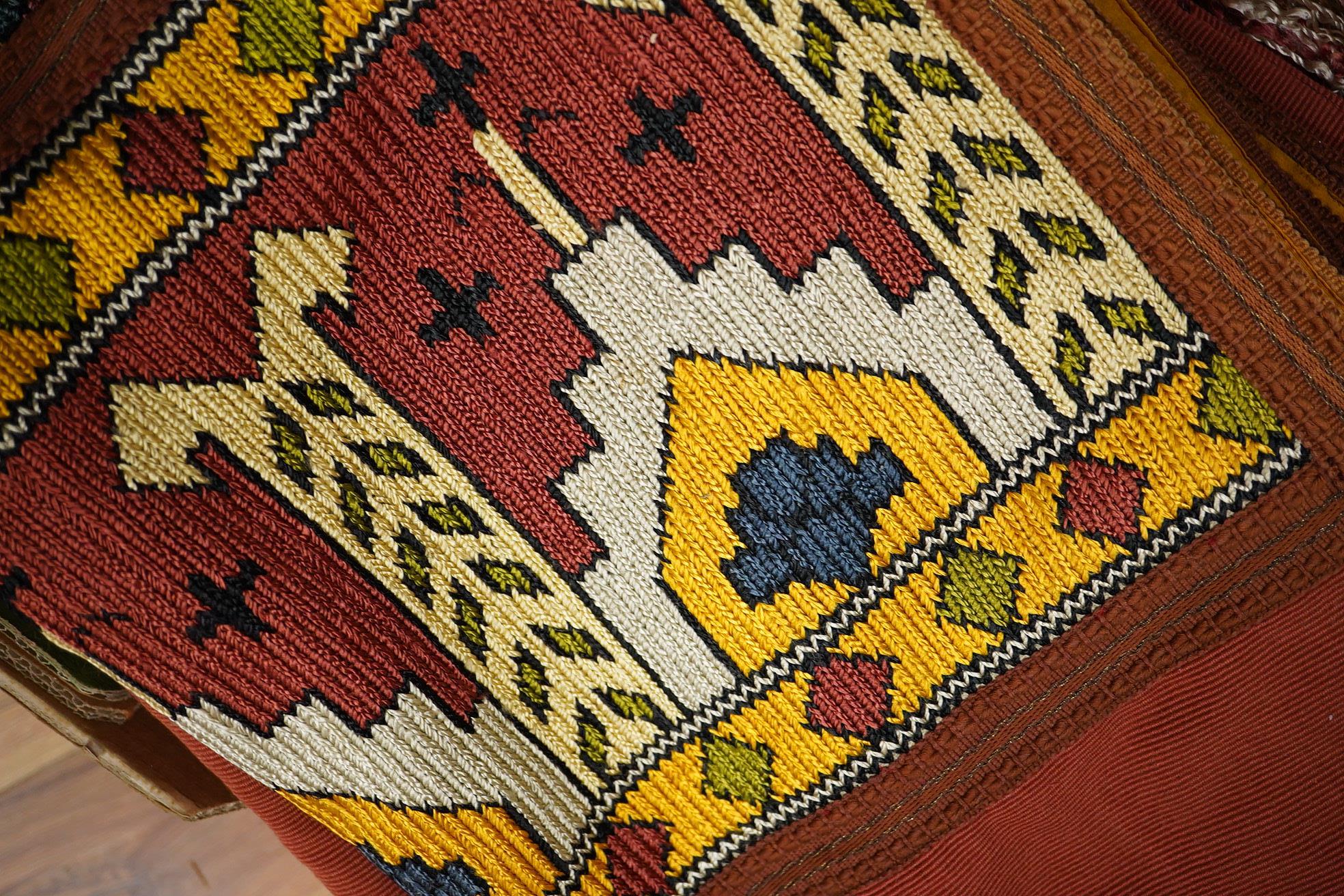 A unusual matching group of 20th century French Ecclesiastical knitted textiles, with Caucasian design elements. Hand embroidered with coloured silks in a bold geometric design, bordered with gold braiding and tasselling